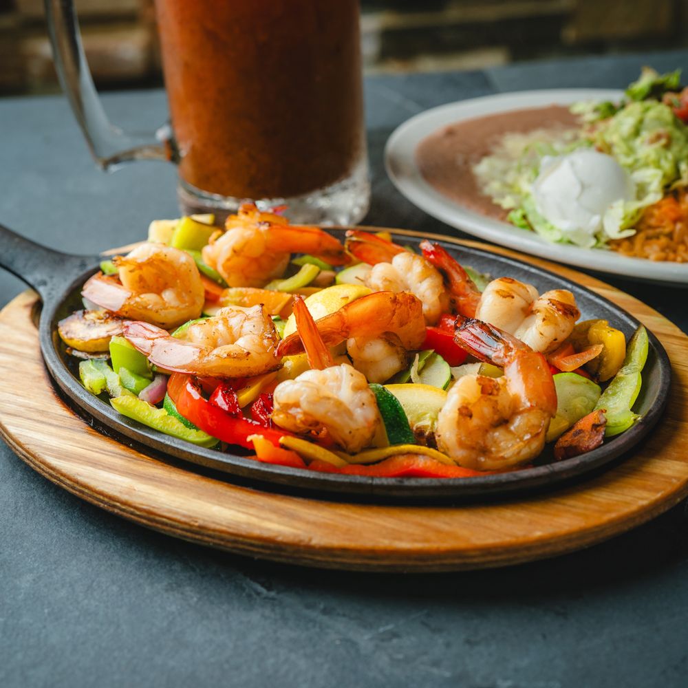 Cabo's Mexican Cuisine and Cantina signature dishes CevicheCamarones al Mojo de AjoMolcajete﻿﻿